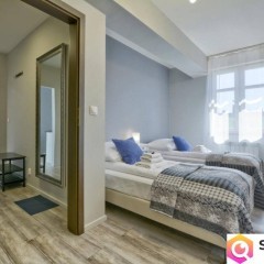 Kamienicę z apartamentami oraz częścią zorganizowanego przedsiębiorstwa sp…