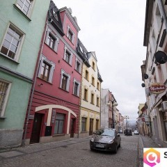 Kamienicę z apartamentami oraz częścią zorganizowanego przedsiębiorstwa sp…